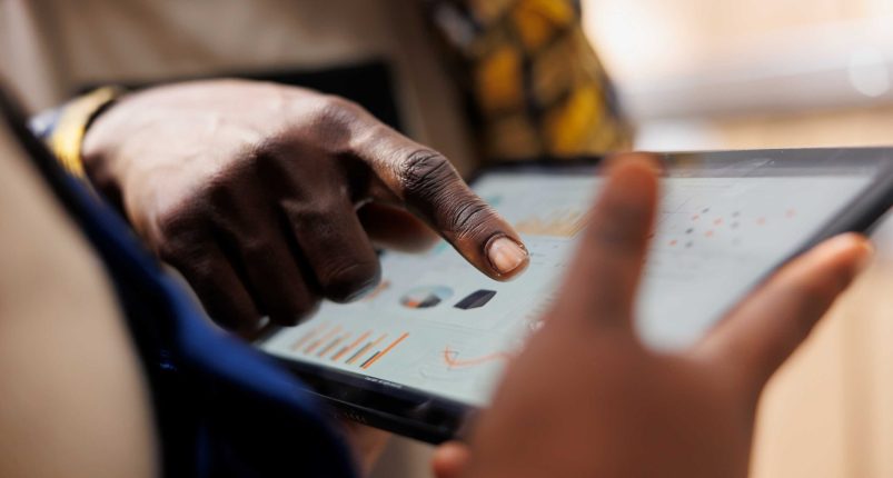 warehouse-worker-hand-pointing-inventory-statistics-tablet (2)